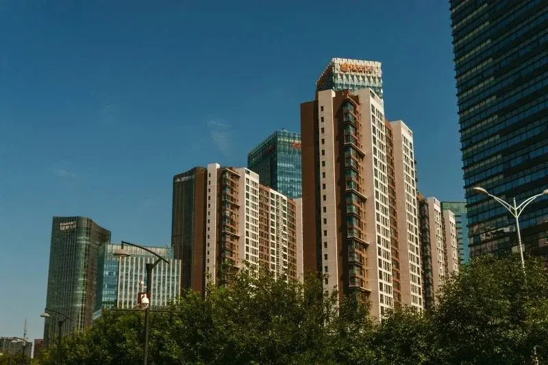 Modern high-rise apartment towers near Beijing's CBD under a clear blue sky