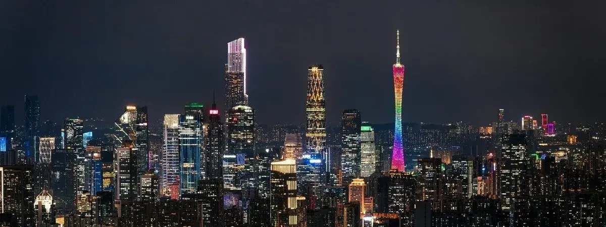 Guangzhou's Canton Tower and the Zhujiang New Town skyline reflected in the Pearl River at night