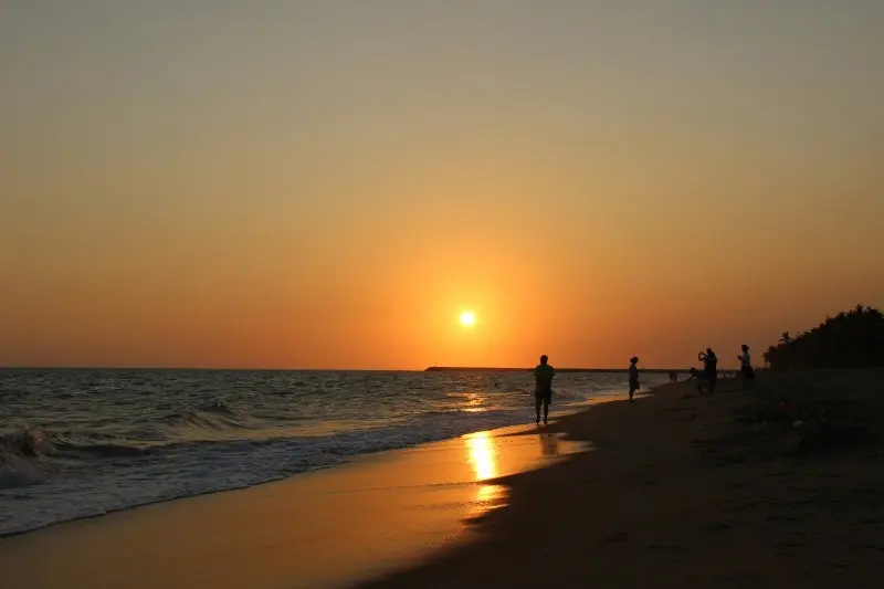 Gorgeous sunset over the ocean waves at a Sanya beach