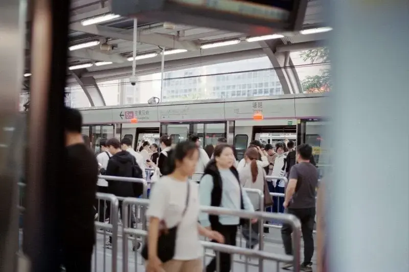 Commuters on the platform at Tanglang station on Shenzhen Metro Line 5