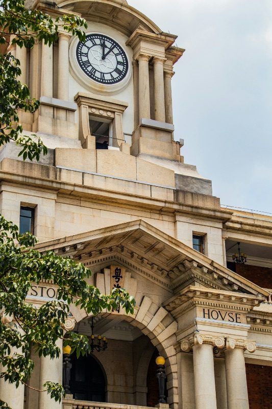 The Canton Customs House (粤海关大楼), known locally as the Big Clock Tower, built 1916, with its Neo-Baroque clock tower and 'CVSTOM HOVSE' lettering above the entrance