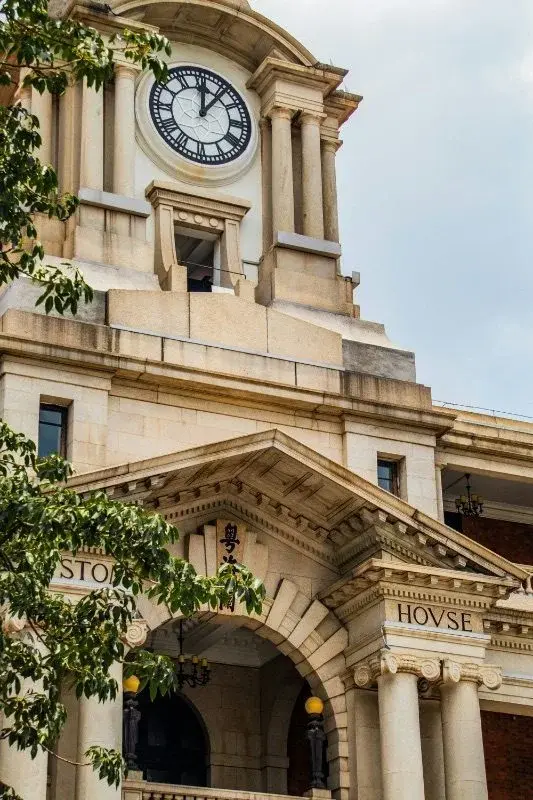 The Canton Customs House, known locally as the Big Clock Tower, built 1916, with its Neo-Baroque clock tower and 'CVSTOM HOVSE' lettering above the entrance