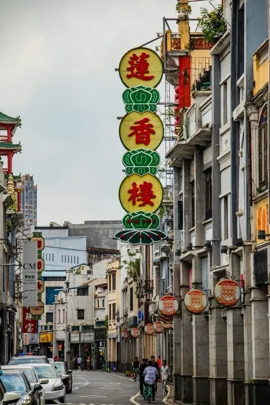 Shangxiajiu pedestrian street in Guangzhou, qilou arcade buildings lined with shop signage including the Lianxianglou restaurant