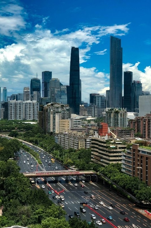Guangzhou's Zhujiang New Town skyline by day, seen above an elevated highway interchange