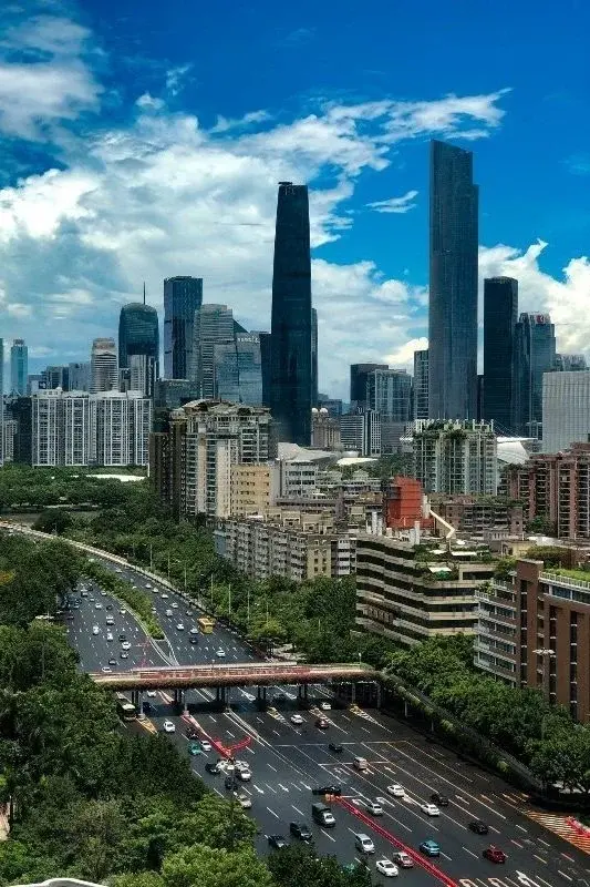 Guangzhou's Zhujiang New Town skyline by day, seen above an elevated highway interchange