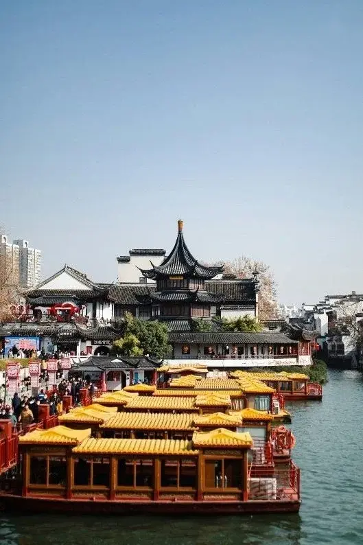The Confucius Temple quarter in Nanjing, its ornate pavilion roofs rising above tour boats on the Qinhuai River