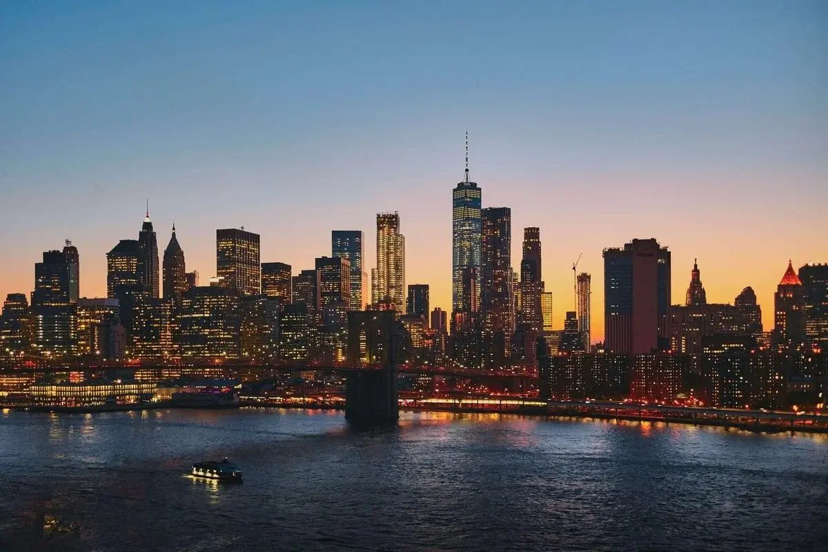 Lower Manhattan skyline and the Brooklyn Bridge at dusk
