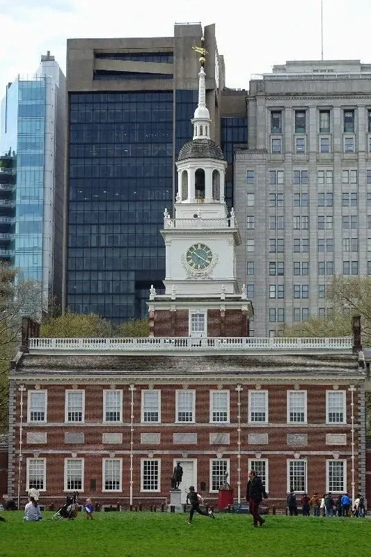 Independence Hall's white steeple against a backdrop of modern Philadelphia office towers