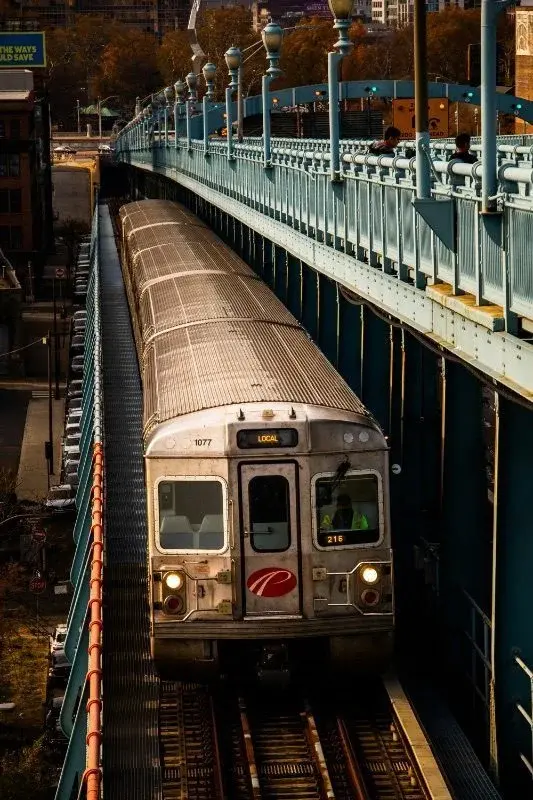 A SEPTA Market-Frankford Line train on the elevated tracks at dusk
