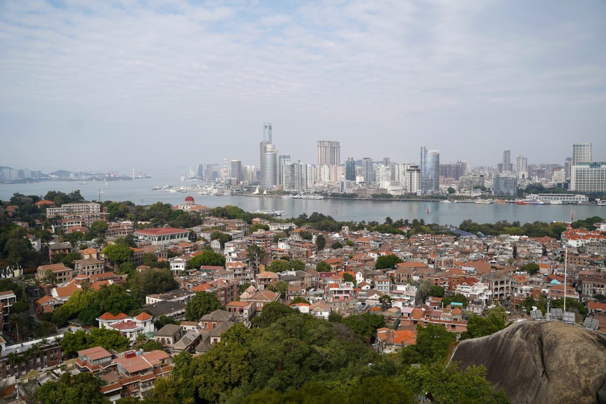 Xiamen's twin towers and Gulangyu's old buildings across the water at dusk