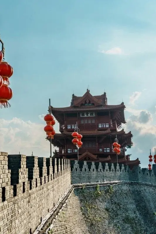 A watchtower on Xi'an's city wall, red lanterns strung along the ramparts