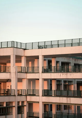 Balconied corridors of a Zhejiang University building at dusk