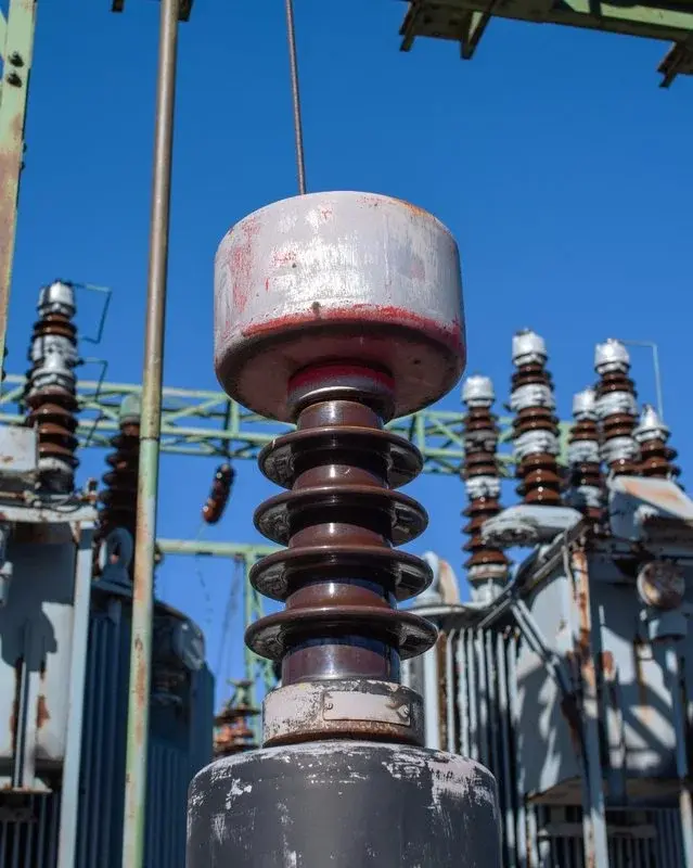 A high-voltage insulator stack at an electrical substation