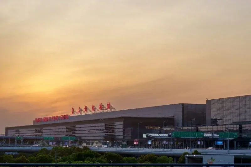 Shanghai Hongqiao Railway Station building at sunset with its illuminated sign